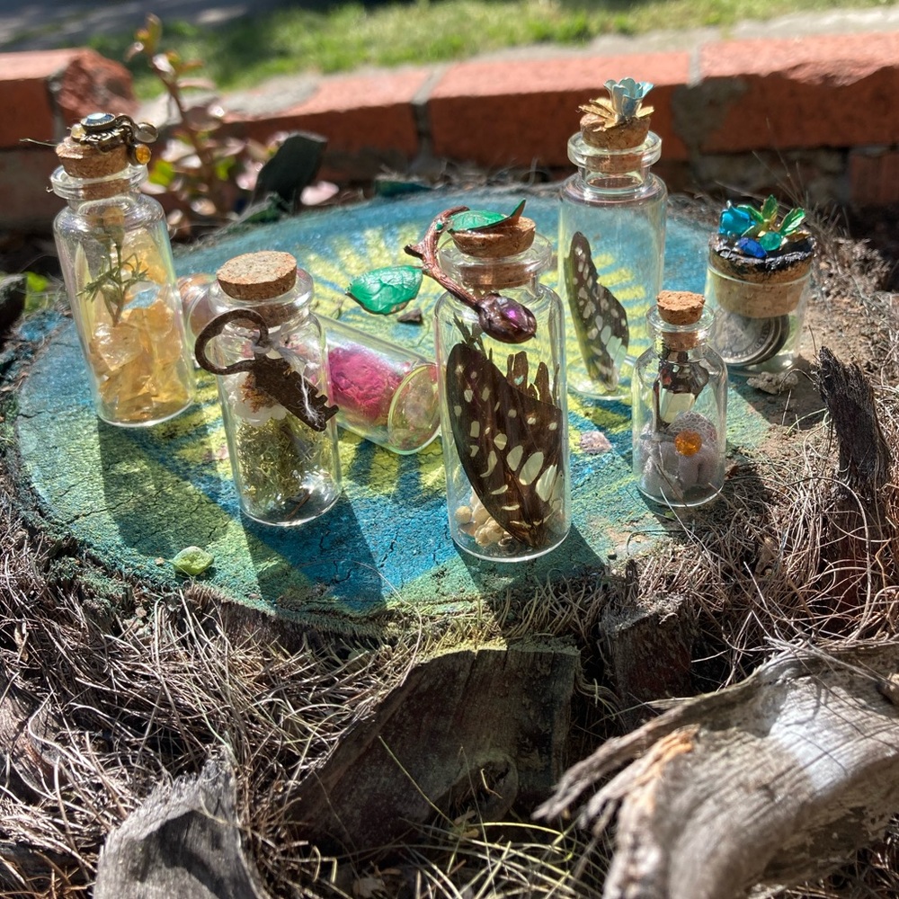 Glass curiosity jars holding beautiful ephemera